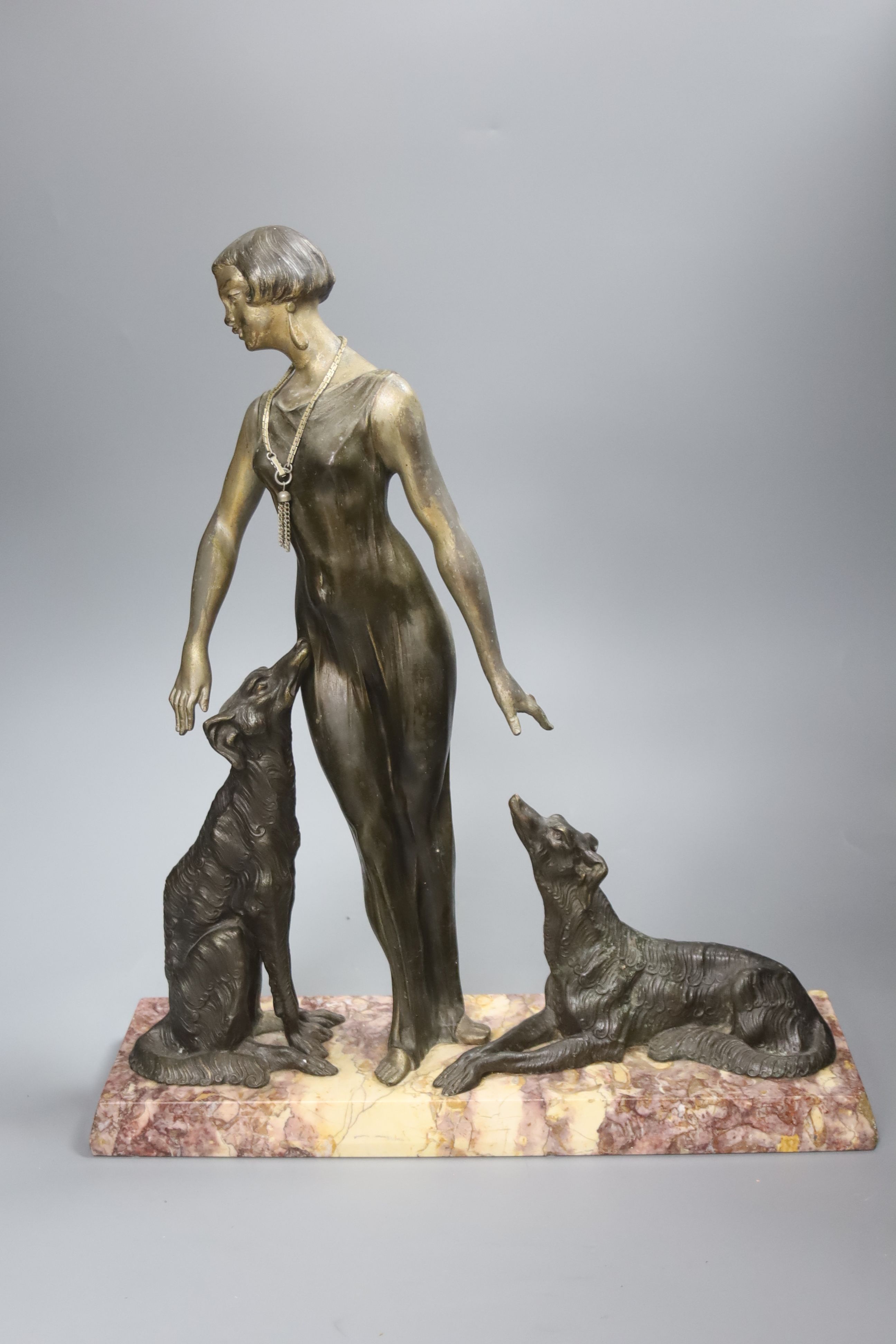 A Spelter Art Deco figure of a dog and borzoi, on a marble base, height 45cm